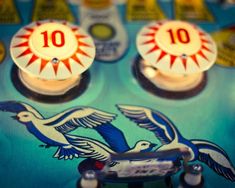 a close up of a game board with two birds on it