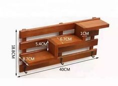 three wooden shelves with wheels on each side and measurements for each shelf in the same direction