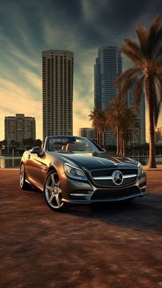 a car parked in the middle of a parking lot with palm trees and tall buildings behind it