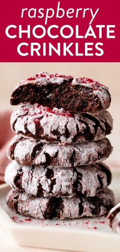 raspberry chocolate crinkles are stacked on top of each other