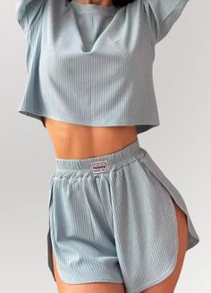 Whether you're winding down after a long day or enjoying a lazy weekend morning, this pajama set is sure to become your go-to. The top features a drop shoulder design for a relaxed fit, and the crop length adds a touch of modern flair. The high-waisted shorts come with a round hem and a flattering side slit. Shorts And Bra Set, Crop Top Pajama Set, Laungarey Outfit, Night Clothes Women, Pj Shorts Outfit, Sweat Shorts Outfits, Short Shorts Outfit, Sleep Fits, Elevated Loungewear