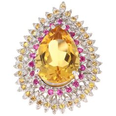 This ring has a natural Pear Cut Citrine that weighs 11.42 carats. The Citrine measures at 19 mm x 14 mm and has a beautiful golden yellow hue. The pink sapphires that adorn the ring weigh 0.84 carats and the yellow sapphires weigh 0.86 carats. There are 72 Round Cut Diamonds that weigh 0.52 carats. The total carat weight of the ring is 13.64 carats. The ring is set in 14 Karat White Gold and weighs approximately 12.5 grams. Gorgeous statement piece! It is a ring size 7 and can be resized at no Gold Cocktail Ring, Pink Men, Gold Cocktail, Pretty Rings, Yellow Sapphire, Golden Yellow, Sapphire Diamond, Pear Cut, Round Cut Diamond