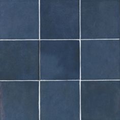 a blue tiled wall with white lines on it