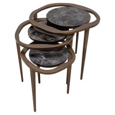 three black marble tables stacked on top of each other with metal rings around the bases