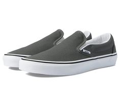 Vans Classic Slip-On Wide - Shoes : Charcoal : Improve speed and comfort of your feet by wearing Vans Classic Slip-On Wide footwear. Textile upper. Textile lining and insole. Slip-on style. Round toe. Elastic side gores. Low-top design. Branding at heel. Synthetic outsole. Imported. Measurements: Weight: 13 oz Product measurements were taken using size Men's 9, Women's 10.5, width Wide. Please note that measurements may vary by size. Weight of footwear is based on a single item, not a pair. Sports Slip-ons With Vulcanized Sole, Vans Cushioned Slip-on Sneakers, Vans Slip-on Sneakers With Cushioned Footbed, Vans Cushioned Footbed Slip-on Sneakers, Comfortable Vans Slip-on Sneakers, Classic Gray Slip-on Sneakers, Comfortable Gray Slip-ons For Sports, Sporty Vans Slip-ons With Rubber Sole, Gray Sporty Slip-ons For Sports