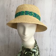 Raffia bucket hat  Straw summer hat with a bright stripe in shades of green.  Crocheted from 100% natural raffia pulp. Hats made of this natural material perfectly pass moisture, do not soar and protect from the sun. A hat with a small brim will provide plenty of shade. The perfect hat for summer travel. Very light and breathable.   Please measure your forehead at the widest point or where you would like the hat to be before placing an order.   Recommended care: * Hand wash in cold water without Handwoven Summer Bucket Hat For Spring, Handwoven Bucket Hat For Spring, Spring Handwoven Bucket Hat, Green Flat Brim Boater Hat For Summer, Green Summer Boater Hat With Flat Brim, Green Boater Hat With Flat Brim For Summer, Summer Handwoven Brimmed Bucket Hat, Spring Bucket Hat With Short Brim, Handwoven, Green Bohemian Fedora Sun Hat