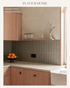 an image of a kitchen setting with oranges on the counter and in your home magazine cover