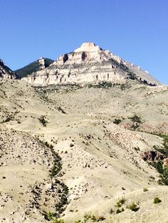 the mountains are covered in sparse vegetation and rocks