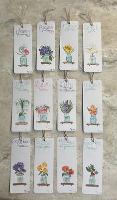 six tags with flowers and sayings on them sitting on a counter top next to each other