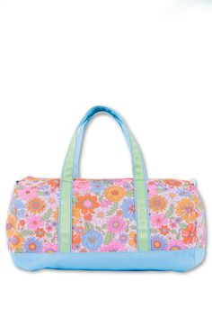 This roomy floral duffle bag  is the perfect bag for sleepovers or vacations and features adjustable straps. Spot Clean Top zip closure Top carry handles Interrior Zip Pocket Made of durable polycanvas Lined in nylon 18" X 10.5" Casual Pink Duffle Bag For Weekend, Pink Casual Weekender Bag, Casual Pink Weekender Bag, Casual Multicolor Travel Bag For Overnight Trips, Casual Multicolor Bag For Overnight Trips, Adjustable Cotton Travel Bags, Summer Camp Essentials, Custom Duffle Bags, Summer Camp Outfits