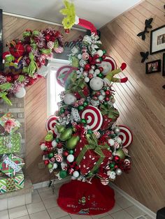 a christmas tree decorated with candy canes and ornaments