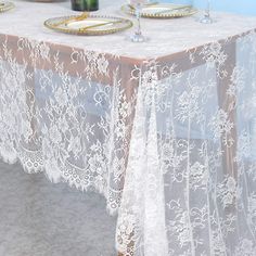 White Lace Tablecloth Rectangular A beautiful antique lace tablecloth rectangle. lace overlay tablecloth offers a classic and timeless feel to any special event such as a party, wedding, bridal shower and baptism. For a rustic and chic inspired wedding add style to your table settings by placing a lace overlay on top of your tablecloth or a lace table runner. Lay the lace which is trending this year over your burlap underlay for a romantic or rustic look. Your wedding color will peek through both the lace fabric and then decorate your tables with your centerpieces. Please see the photo of the close up of the lace so you can see its pattern clearly. This truly is a beautiful piece and is definitely worth your consideration! Features: Made of premium quality fabric, durable and reusable, wil Lace Tablecloth Wedding, Table Covers Wedding, Lace Table Cloth, Romantic Candle Light Dinner, Halloween Tablecloth, Rustic Boho Wedding, Lace Table Runners, Party Table Cloth, Lace Table