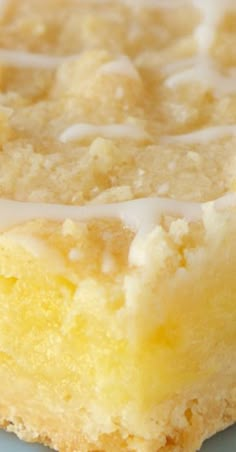 a close up of a piece of cake on a plate with frosting and icing