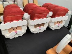 three santa clause boxes sitting on top of a table