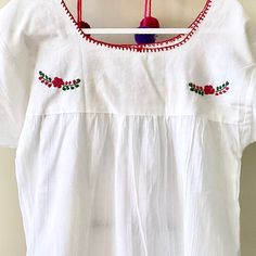 This traditional Mexican blouse is beautifully made in Merida Yucatan, Mexico, each piece is individually hand made and hand embroidered. You will love this lightweight blouse made of organic cotton, this natural material gives the blouse a delicate and relaxed feel. Details: Size M-L measurements: Bust: 42” - 29” length(shoulder to bottom Hem) Cotton thread Embroidered Material: 100% Cotton All items are shipped from the US All Mi Mundo Mexicano items are 100% handmade by artisans in Mexico. Ea Peasant Style Cotton Blouse With Yoke, Peasant Style Cotton Blouse With Yoke Detail, Cotton Peasant Blouse With Embroidered Neckline, White Cotton Blouse With Embroidered Hem, White Cotton Folk Embroidered Top, White Bohemian Embroidered Cotton Top, White Folk Style Embroidered Cotton Top, Folk Style Cotton Peasant Top With Floral Embroidery, White Cotton Peasant Embroidered Top