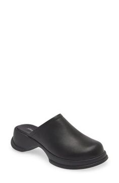 A sculpted rubber sole enhances the cushioned comfort of this shapely clog constructed from smooth leather. 2" heel; 3/4" platform (size 8.5) Leather upper and lining/rubber sole Imported Classic Black Synthetic Clogs, Classic Synthetic Clogs With Leather Sole, Platform Clogs With Synthetic Material For Work, Classic Slip-on Synthetic Clogs, Modern Clogs With Cushioned Footbed For Work, Workwear Platform Clogs With Synthetic Material, Synthetic Slip-on Clogs With Removable Insole, Workwear Synthetic Platform Clogs, Classic Closed Toe Synthetic Clogs