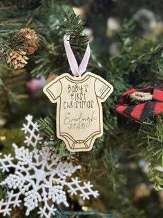 a christmas ornament hanging from the top of a tree