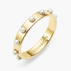 Classic elements like 14k gold and pearls come together beautifully in our Holly Pearl Ring, a style that strikes the balance between sweet and ladylike and totally modern. This versatile ring looks gorgeous on its own or stacked with other favorite ring styles. Available in 14k gold plated brass Band width: 3mm Simulated 2mm pearls Made in the USA SKU: BYR1033 Gold And Pearls, Unique Engagement Rings Rose Gold, Preppy Jewelry, Dot Ring, Gold Pearl Ring, Ring Styles, Jewelry Lookbook, Work Week, The Balance