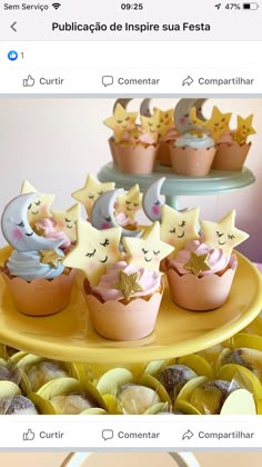 an image of cupcakes on a plate with stars and moon decorations in them