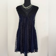 Cute Black And Blue Lace Dress With Deep V Front And Back. The Skirt Is Lined But The Bust Is Not, Pair With A Cami Or Lace Bra. Cotton/Nylon Blend Euc Never Worn Approximate Measurements Length- 32” Put To Pit- 18” Casual V-neck Mini Dress With Lace Trim, Sheer Lace V-neck Mini Dress, Lace Trim V-neck Mini Dress, Bohemian Lace Mini Dress For Night Out, Bohemian Sleeveless Lace Dress For Party, Bohemian Sleeveless Lace Party Dress, Blue Lace Dress, Lace Blue Dress, Free People Dress