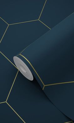 a dark blue wallpaper with gold lines and a white circle in the middle on it