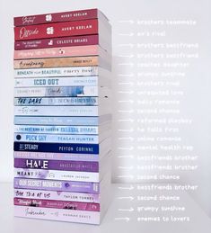 a stack of books sitting next to each other on top of a white countertop