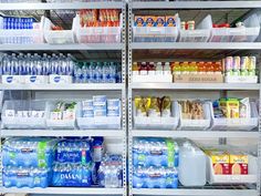 the shelves are filled with many different types of bottled water