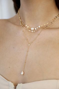 Materials 18k Gold Plated, Brass, Cubic Zirconia, Freshwater Pearls Length 11"-13" and a 5" extender chain Drop Length 3.25" Closure Clasp