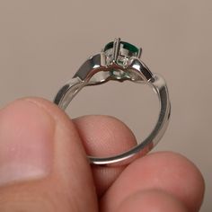 This is a gorgeous handmade creation. Its beauty is its simplicity & Elegance. The 6*6mm round shape faceted lab Emerald is crafted in solid sterling silver and with rhodium plated. All item is sent in a beautiful gift box If you have any idea of design your ring,pls contact me directly. You can realize more lovely stuff clicking the link https://www.etsy.com/shop/knightjewelry?refshopsection_shophome_leftnav Please leave the correct address and you phone number for delivering successfully. Sterling Silver Ring With Center Stone For May Birthstone, Sterling Silver Emerald Ring With Bezel Setting, Sterling Silver Emerald Ring With Accent Stones, Sterling Silver Rings With Accent Stones And Round Cut, Solitaire Round Emerald Ring For Promise, Round Emerald Solitaire Ring For Promise, Round Solitaire Emerald Promise Ring, Silver Emerald Ring With Bezel Setting, Sterling Silver Emerald Ring With Center Stone