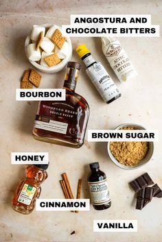 the ingredients to make this chocolate bar recipe are shown on a counter top, including peanut butter, bourbon, brown sugar, cinnamon, and vanilla