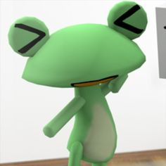 a green frog is standing in front of a white board with black letters on it