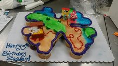 there is a birthday cake made to look like a map