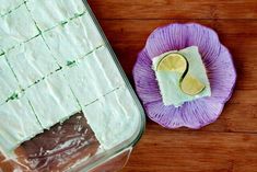 the cake is ready to be cut into squares and put in the baking dish on the table