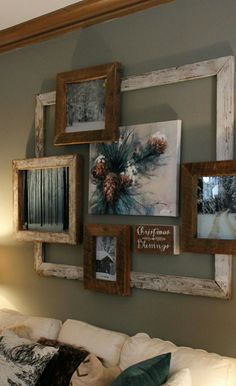 a living room filled with furniture and pictures on the wall