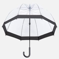 an open umbrella with black and white details on the outside, against a gray background