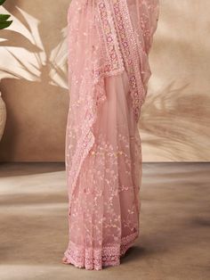 Designed to perfection, this stunning peach saree is adorned with intricate thread work, sequin work, and zarkan work, adding a touch of glamour and elegance to your look. The saree comes with a matching color net blouse featuring the same detailed embellishments, creating a cohesive and sophisticated ensemble.
The 5.50-meter saree and unstitched blouse material allow for customization according to your size and style preferences, ensuring a perfect fit and a personalized touch. Whether you're a Peach Saree With Dupatta For Reception, Anarkali Peach Saree With Zari Work, Peach Anarkali Saree With Zari Work, Peach Saree With Resham Embroidery For Reception, Peach Saree With Zari Work, Peach Semi-stitched Saree For Wedding, Peach Resham Embroidery Wedding Saree, Bollywood Style Peach Saree For Reception, Bollywood Style Peach Saree For Wedding