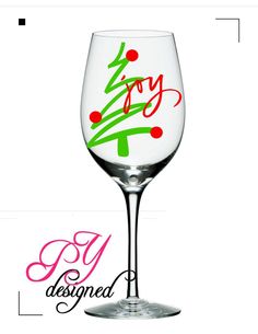 a wine glass with the words joy designed on it