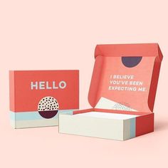 an open box that says hello and the inside is red with white dots on it