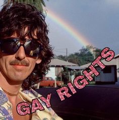 a man wearing sunglasses and a tie with the words gay rights on it in front of a rainbow