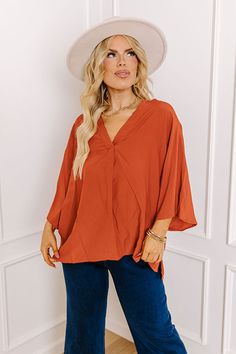 People are sure to stay and chat with you about where you got this darling plus size rust colored shift top featuring lightweight flowy material, a v-cut neckline, loose 3/4-length sleeves, and a relaxed silhouette that falls into a straight hemline with accent side slits! Measurements 1XL : Bust 56", Hip 52", Length 26", Sleeve Length 18", Waist 54". 2XL : Bust 58", Hip 54", Length 27", Sleeve Length 18", Waist 56". 3XL : Bust 60", Hip 56", Length 28", Sleeve Length 19", Waist 58". Flowy Orange V-neck Blouse, Brown Flowy V-neck Top, Plaid Jacket, Model Fits, V Cut, Rust Color, V Cuts, Women Clothing Boutique, Hip Length