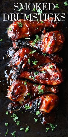 chicken wings covered in bbq sauce and garnished with parsley on top