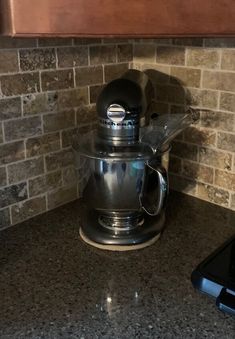 a coffee maker sitting on top of a kitchen counter