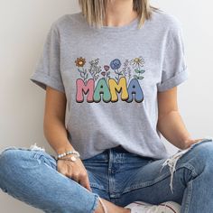 Mama Shirt, Wildflowers Mama Shirt, Mama Shirt, Retro Mom Shirt, Mother's Day Gift, Flower Shirts for Women, Floral New Mom Gift Thank you so much for taking the time to browse my shop. Please feel free to reach out if you have any questions before or after purchasing.  💖 🎨Warning: On products with a print chart in the listing, metallic print colors are printed as matte. We design and cut each graphic out with a soft touch, use matte vinyl and a heat press. The result will last for many washes Gift Flower, New Mom Gift, Metallic Prints, Flower Shirt, Shirts For Women, Mama Shirt, New Mom, Gifts For New Moms, Mom Shirt