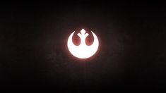 the star wars symbol is glowing in the dark