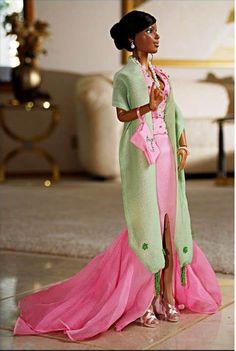 a barbie doll dressed in pink and green