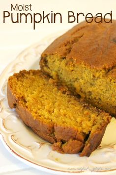 a loaf of pumpkin bread on a white plate with the words moist pumpkin bread above it