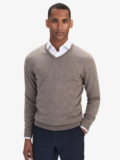 Men’s merino wool sweaters – V-neck sweater.
Our signature merino wool sweater with a v-neck is a classic knitwear staple that will transcend seasons and trends. This lightweight sweater is cut for a regular fit and finished with cozy ribbed trims. There’s no problem with wearing a merino wool sweater, as they tend to fit with almost every single piece of clothing, from elegant suits to classy jeans. As well as they defy trends, set styles and flatter every kind of body type.

Material:100% Meri Classic Merino Wool Polo Sweater, Classic Merino Wool Crew Neck Polo Sweater, Mens Merino Wool Sweaters, Beige Textured Merino Wool Sweater, Classy Jeans, Classic Knitwear, Young Adult Fashion, Luxury Men's Wool V-neck Sweater, Merino Sweater