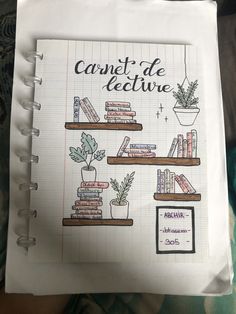 a notebook with drawings of books and plants on top of each bookcase, which is written in french