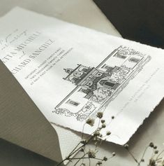 a piece of paper that is on top of some flowers