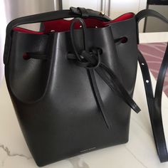 Used Only A Couple Of Times. Comes With Box And Dust Bag Classic Black Pouch Bucket Bag, Formal Bucket Satchel With Dust Bag, Designer Black Satchel Bucket Bag, Designer Black Bucket Bag For Everyday, Formal Black Bucket Bag Pouch-shaped, Formal Black Bucket Satchel, Black Formal Bucket Bag, Mansur Gavriel Bag, Fringe Tote Bag